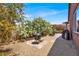 Landscaped backyard with gravel and a fire pit at 7428 Alamo Ranch Ave, Las Vegas, NV 89179