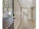 A bright and spacious entryway featuring hardwood floors, a decorative front door and neutral walls at 7428 Alamo Ranch Ave, Las Vegas, NV 89179