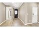Inviting foyer with hardwood floors, decorative front door, and easy access to other areas of the home at 7428 Alamo Ranch Ave, Las Vegas, NV 89179