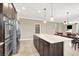 Spacious kitchen with a large island, stainless steel appliances, and an open layout at 7428 Alamo Ranch Ave, Las Vegas, NV 89179