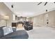 This open-concept living room connects seamlessly to the dining room and kitchen at 7428 Alamo Ranch Ave, Las Vegas, NV 89179
