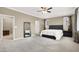Spacious main bedroom with neutral walls, dark furniture, and soft carpeting at 7428 Alamo Ranch Ave, Las Vegas, NV 89179