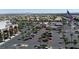 Commercial area with retail stores, parking lots, palm trees, and distant city views at 7515 Emerald Stars St # 102, North Las Vegas, NV 89084