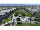 Aerial view of a community featuring a pool, green spaces, and well-maintained homes at 7515 Emerald Stars St # 102, North Las Vegas, NV 89084