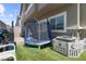 Cozy backyard with artificial turf, trampoline, and play area, perfect for outdoor fun at 7515 Emerald Stars St # 102, North Las Vegas, NV 89084