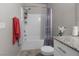 Bright bathroom featuring a shower-tub combo, neutral wall color, and white vanity with granite countertops at 7515 Emerald Stars St # 102, North Las Vegas, NV 89084