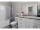 Bright bathroom featuring a shower-tub combo, neutral wall color, and white vanity with granite countertops at 7515 Emerald Stars St # 102, North Las Vegas, NV 89084