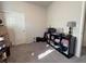 Bedroom with a desk, shelving, and neutral color scheme at 7515 Emerald Stars St # 102, North Las Vegas, NV 89084