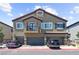 Charming townhouse with three garage doors and a small balcony at 7515 Emerald Stars St # 102, North Las Vegas, NV 89084