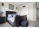 Comfortable main bedroom with a well-lit ambiance, stylish decor, and carpet flooring at 7515 Emerald Stars St # 102, North Las Vegas, NV 89084