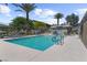 Community pool with clear blue water, lounge chairs, and well-maintained surrounding area at 7515 Emerald Stars St # 102, North Las Vegas, NV 89084