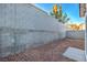 Backyard featuring gravel and a tall block wall for added privacy at 7849 Montour Falls St, Las Vegas, NV 89149