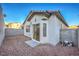 Backyard with gravel, a block wall, with a glimpse of the house at 7849 Montour Falls St, Las Vegas, NV 89149