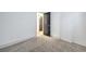 Carpeted bedroom with neutral tones and modern doors provides a serene living space at 7849 Montour Falls St, Las Vegas, NV 89149