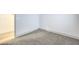 Neutral bedroom featuring carpet, white walls, and a view of the wood floor at 7849 Montour Falls St, Las Vegas, NV 89149