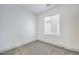 A bright bedroom features neutral carpet, white walls, and a window with blinds for natural light at 7849 Montour Falls St, Las Vegas, NV 89149