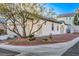 Charming single-story home with desert landscaping and a tree in the front yard at 7849 Montour Falls St, Las Vegas, NV 89149