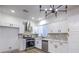 Modern kitchen featuring white cabinets, stainless steel appliances and pendant lighting at 7849 Montour Falls St, Las Vegas, NV 89149