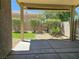 A private backyard featuring rock landscaping, turf grass, and a covered patio at 7957 Fantail Dr, North Las Vegas, NV 89084