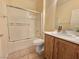 Bathroom featuring tile flooring, modern fixtures, and a shower-tub combo at 7957 Fantail Dr, North Las Vegas, NV 89084