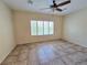Bright bedroom with tile flooring and window with shutters at 7957 Fantail Dr, North Las Vegas, NV 89084
