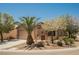 Charming single-story home with desert landscaping and a neutral color scheme, offering curb appeal at 7957 Fantail Dr, North Las Vegas, NV 89084