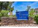 Aliente Golf Club sign set in a stone base against the backdrop of lush trees and blue skies at 7957 Fantail Dr, North Las Vegas, NV 89084
