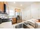Well-equipped kitchen with stainless steel appliances, wood cabinets, and a double sink at 7957 Fantail Dr, North Las Vegas, NV 89084