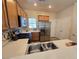 Bright kitchen featuring stainless steel appliances, stylish backsplash, and ample counter space at 7957 Fantail Dr, North Las Vegas, NV 89084