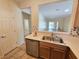 Open concept kitchen with stainless steel dishwasher and view to a naturally lit living room at 7957 Fantail Dr, North Las Vegas, NV 89084
