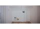 A dedicated laundry area featuring tile flooring and a wire shelf, providing convenient storage space at 7957 Fantail Dr, North Las Vegas, NV 89084