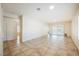 Bright living room with tile floors and sliding glass doors to let in natural light at 7957 Fantail Dr, North Las Vegas, NV 89084