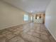 Open living room featuring neutral paint colors and tile floors at 7957 Fantail Dr, North Las Vegas, NV 89084