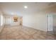 Expansive living room with tile flooring, neutral paint, and plenty of natural light at 7957 Fantail Dr, North Las Vegas, NV 89084