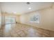 Bright and airy living room with tile flooring, neutral walls, and sliding glass doors at 7957 Fantail Dr, North Las Vegas, NV 89084