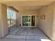 An outdoor covered patio with concrete pavers, offering a relaxing outdoor space at 7957 Fantail Dr, North Las Vegas, NV 89084