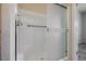 Close-up of a shower with a frosted glass door and a grab bar for assistance at 7957 Fantail Dr, North Las Vegas, NV 89084