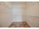 Walk-in closet with wire shelving and tile flooring for organized storage at 7957 Fantail Dr, North Las Vegas, NV 89084