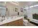 Nicely decorated bathroom with a glass enclosed shower, tile flooring, and single sink vanity at 8356 Shady Lady Ct, Las Vegas, NV 89131