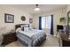 Comfortable bedroom features a queen-sized bed and ample natural light at 8356 Shady Lady Ct, Las Vegas, NV 89131
