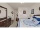 A serene bedroom with a comfortable bed, dresser, and tasteful decor at 8356 Shady Lady Ct, Las Vegas, NV 89131
