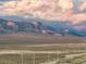 Scenic mountain range view with dramatic cloud formations and desert landscape featuring distant powerlines at 8356 Shady Lady Ct, Las Vegas, NV 89131