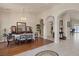 Elegant dining room featuring hardwood floors, arched entryways, and natural light at 8356 Shady Lady Ct, Las Vegas, NV 89131