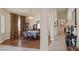 Bright dining room with hardwood floors, a decorative chandelier, and arched doorways leading to other rooms at 8356 Shady Lady Ct, Las Vegas, NV 89131