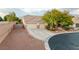 Inviting single-story home with a three-car garage and mature tree at 8356 Shady Lady Ct, Las Vegas, NV 89131