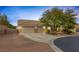 Inviting single-story home with a three-car garage and desert landscaping at 8356 Shady Lady Ct, Las Vegas, NV 89131