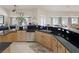 Modern kitchen with stainless steel appliances and a breakfast bar overlooking the living area at 8356 Shady Lady Ct, Las Vegas, NV 89131