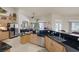Bright kitchen with stainless steel appliances and a view of the backyard pool at 8356 Shady Lady Ct, Las Vegas, NV 89131