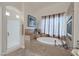 Tranquil bathroom featuring soaking tub, tiled shower, and serene decor at 8356 Shady Lady Ct, Las Vegas, NV 89131