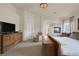Bright main bedroom featuring fireplace, large dresser and comfortable seating at 8356 Shady Lady Ct, Las Vegas, NV 89131